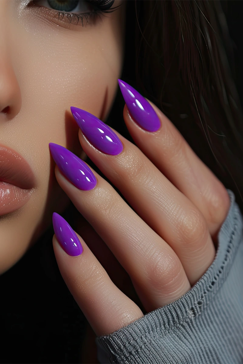 beautiful girl with bright purple nail polish
